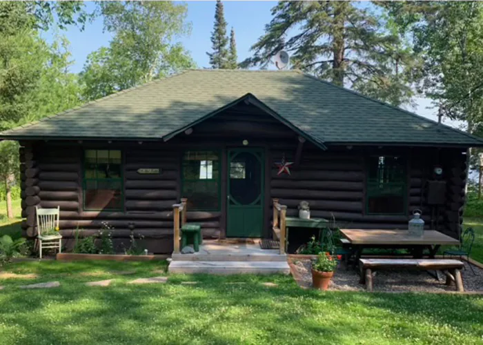 Log cabin exterior before restoration